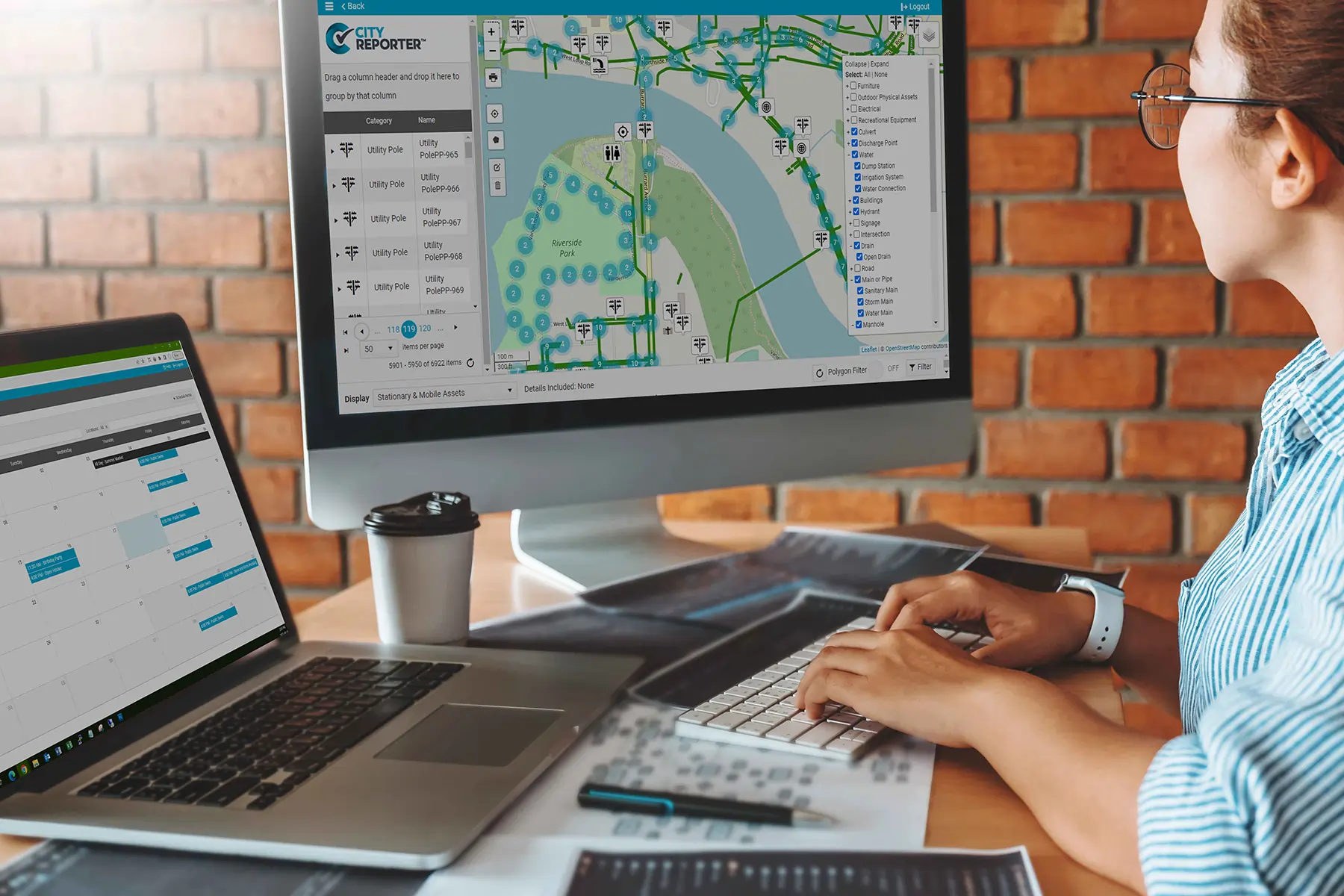 A city employee using asset mapping and scheduling software to manage workflow